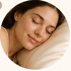 A woman resting her face on a soft pillowcase
